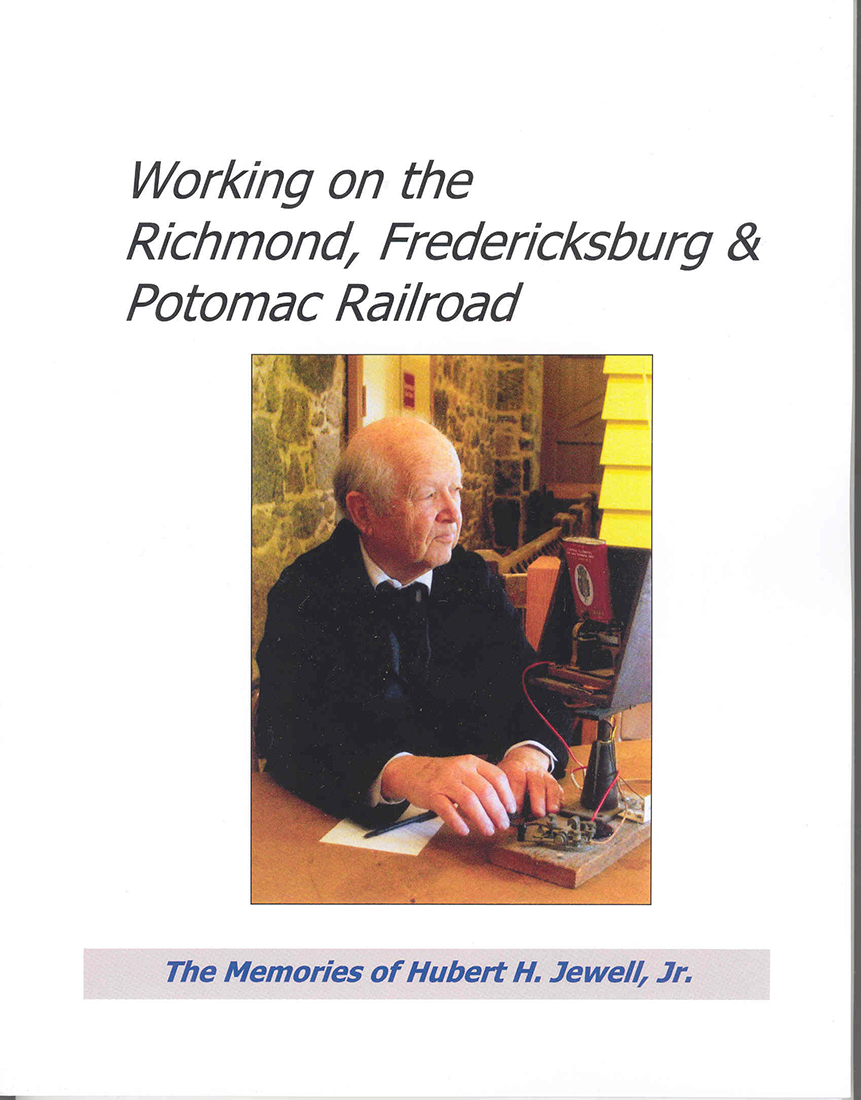Photo of the cover of the book Working on the Richmond Fredericksburg and Potomac Railroad by Hubert Jewell. Cover is white with a color photograph of Hubert Jewell seated looking to the right wearing a dark colored shirt, white shirt, and necktie while operating a telegraph key.
