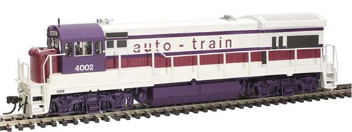 Photo of HO scale auto-train U36B diesel locomotive in white with red and purple striping and purple underbody sitting on a piece of track on white background..